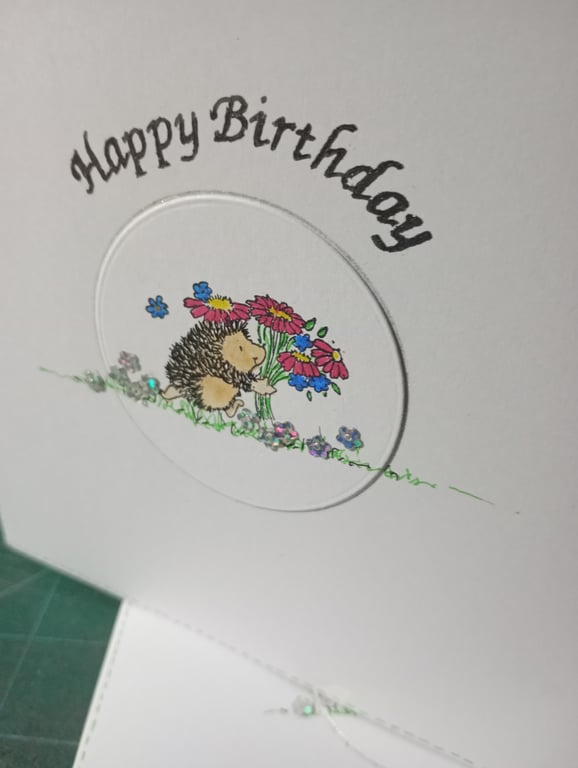 Cute hedgehog with bouquet birthday card 