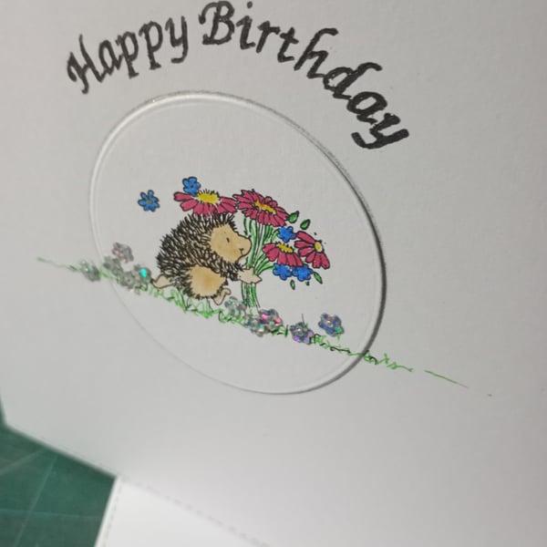 Cure hedgehog with bouquet birthday card 
