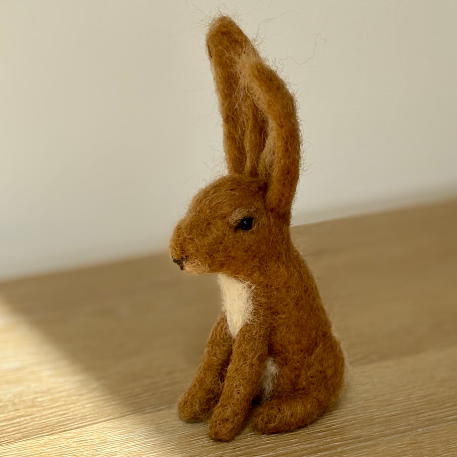 Needle felt country rabbit, handcrafted with wool. Stands 17cm tall