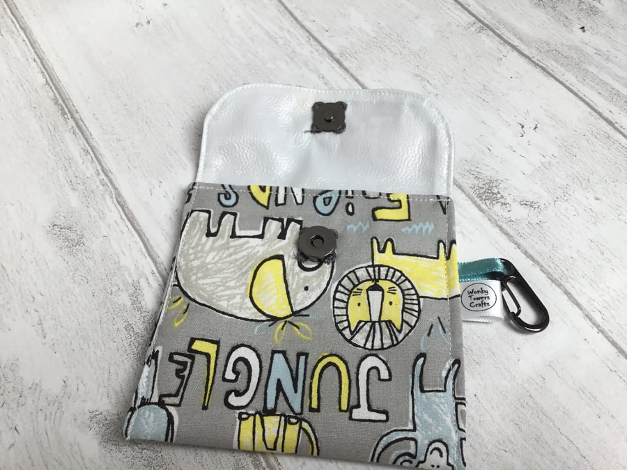 Dog treat or snack pouch with wipe-clean lining. Cartoon animal design.