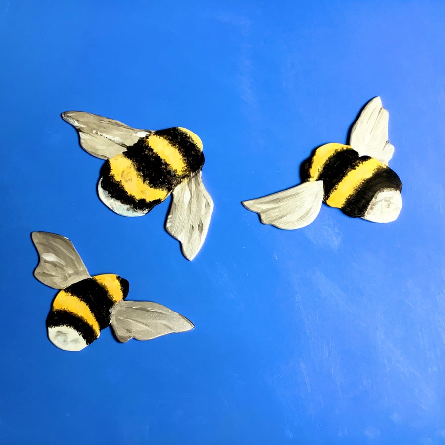 3 flying bees