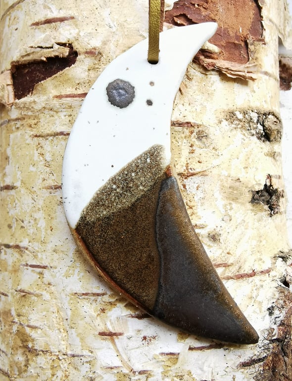 Handmade stoneware crescent moon decoration in neutral toned glazes