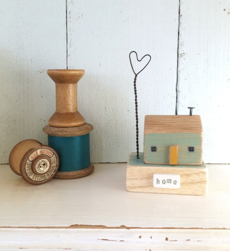 Little green house 'home' with wire love heart