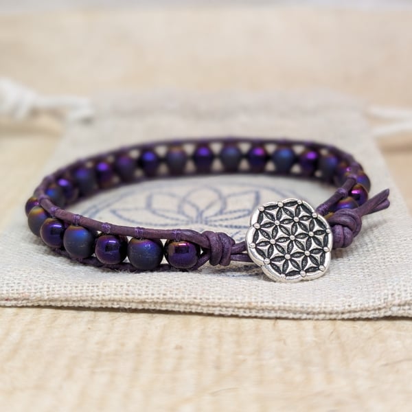 Purple shiny and matt hematite and leather bracelet with button fastener 