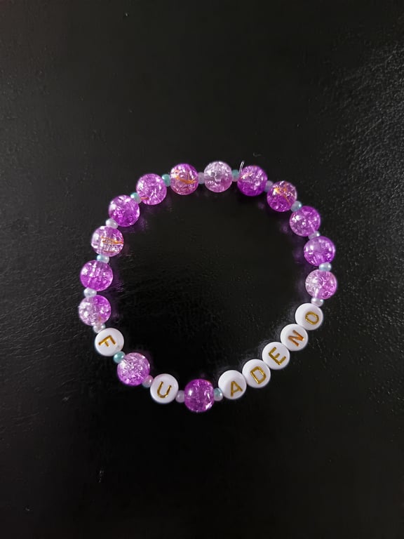 Elasticated adenomyosis letter bracelet with purple and pearl beads