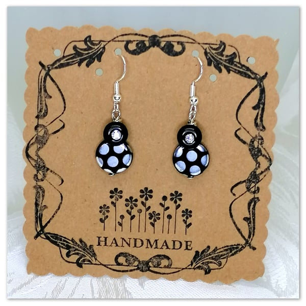  Handmade Glass bead earrings with metallic spot pattern on silver plated hooks.