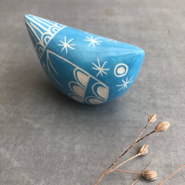 Small turquoise  ceramic bird .