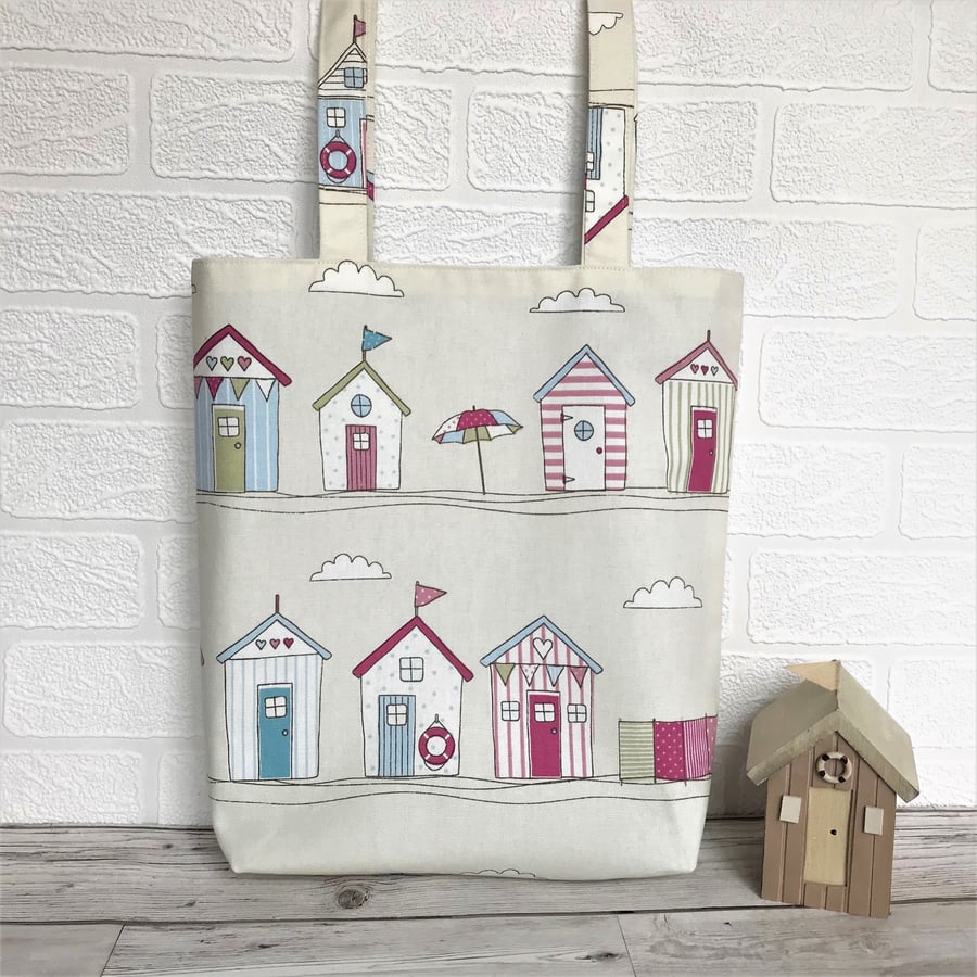 Beach huts tote bag in cream with pastel beach huts print pattern
