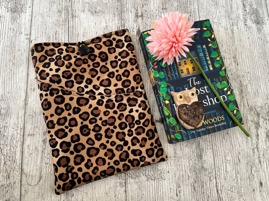 Fabric book sleeve with pocket for paperback book padded and fully lined. 