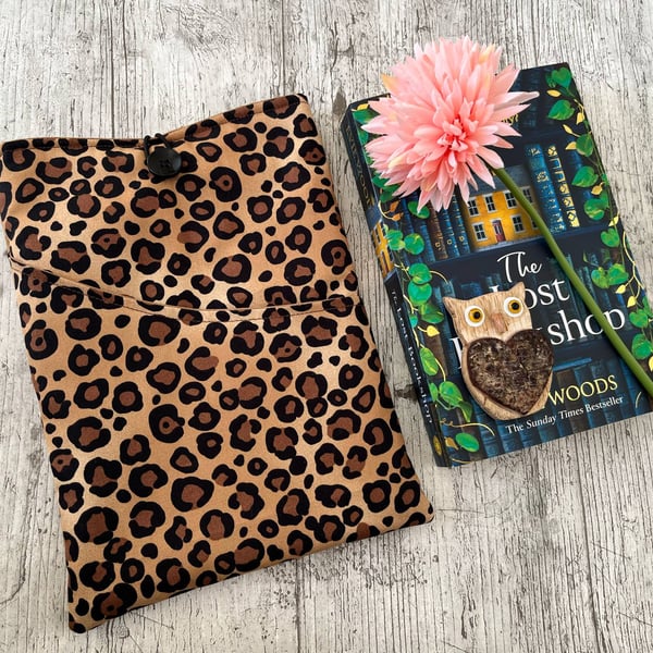 Fabric book sleeve with pocket for paperback book padded and fully lined. 