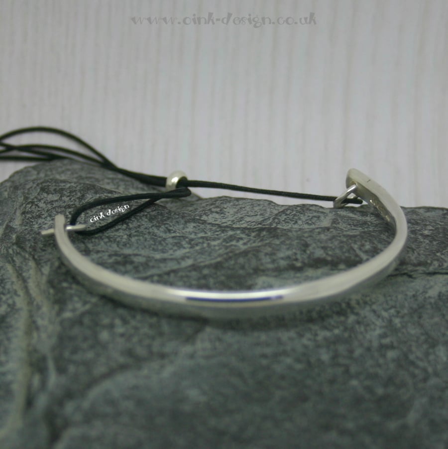 Sterling silver bangle with adjustable cord