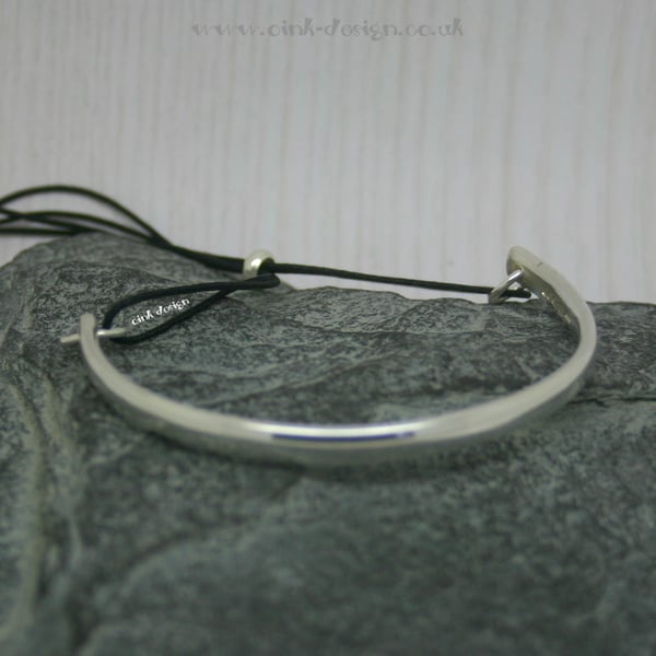 Sterling silver bangle with adjustable cord