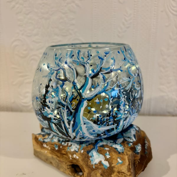 A hand painted and fired glass bowl on driftwood by Andrew Jenkins 