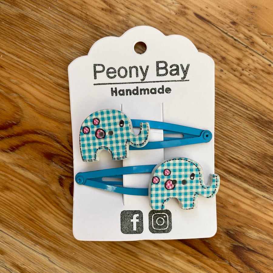 Girl’s elephant hair clips in blue