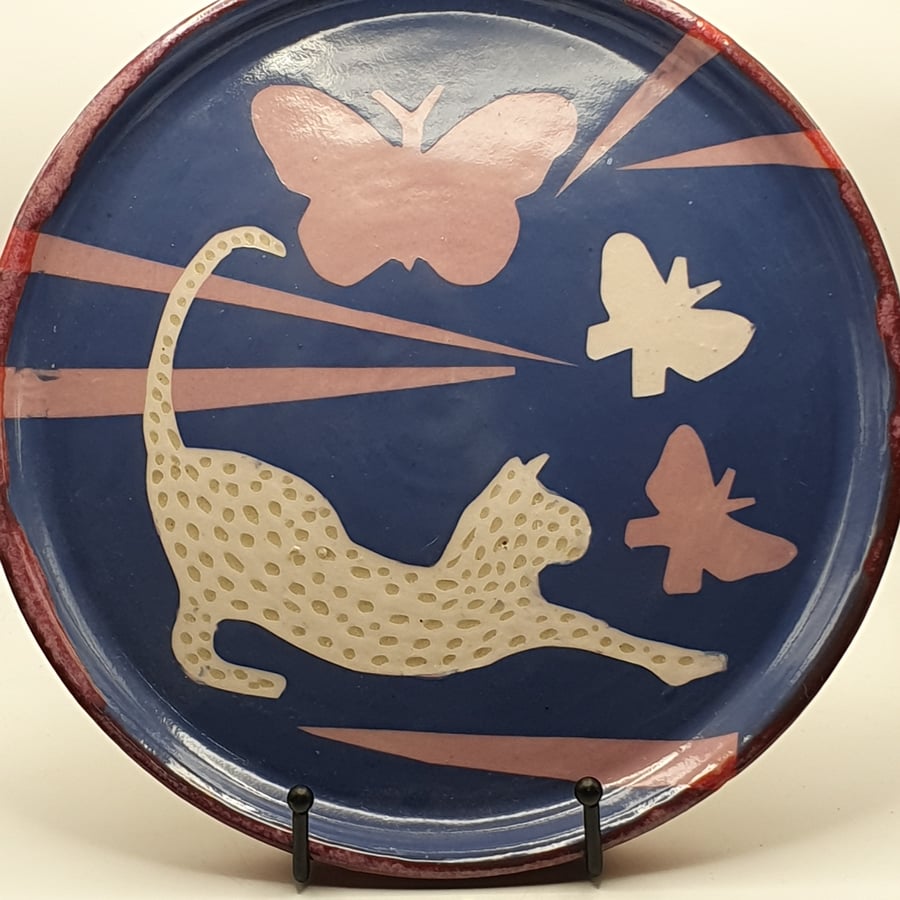 Quirky cat chasing butterflies plate