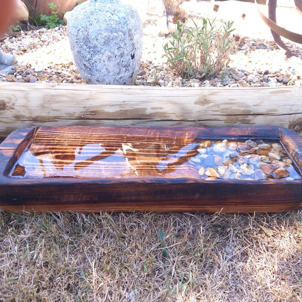 Bird Spa made from 80 year old joist