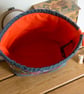 Drawstring project bag made with bright floral print in grey and orange - Image 6
