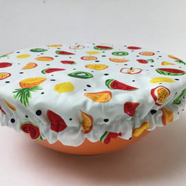 Medium reusable bowl cover to keep food fresh and safe. Tropical fruit.