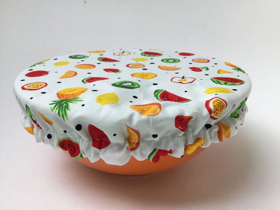 Medium reusable bowl cover to keep food fresh and safe. Tropical fruit.