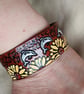 Handmade Leather Bracelet with a Surreal Design. Dolphins and Sunflowers