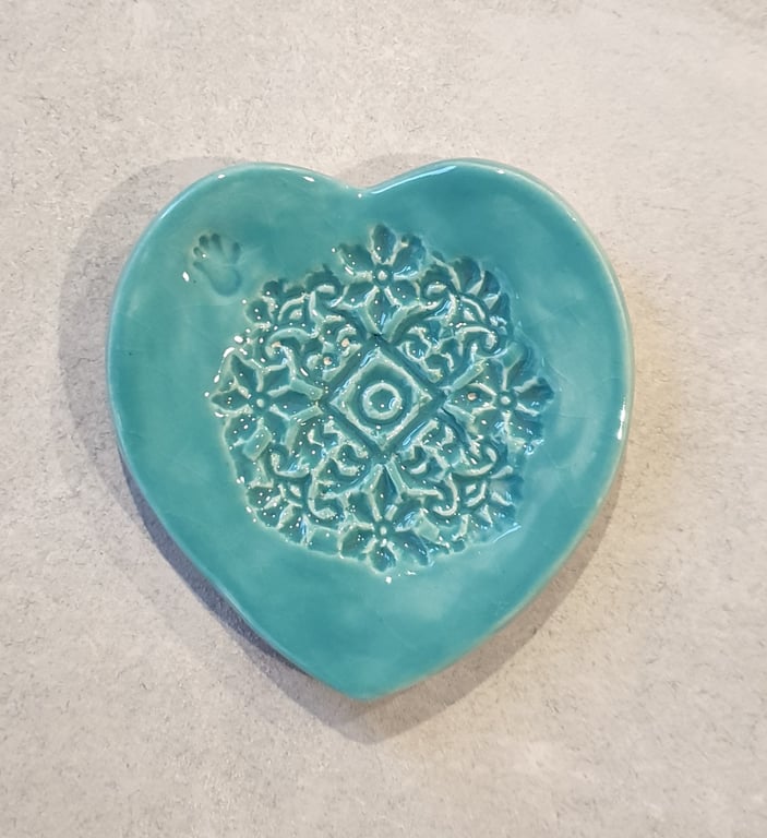 Embossed heart ring dish.