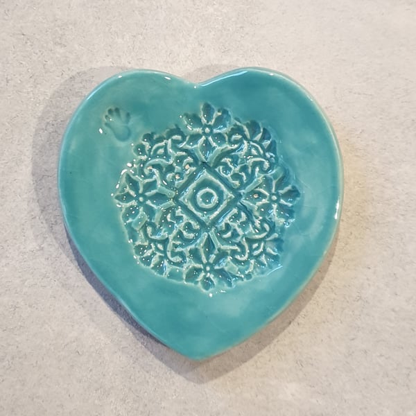 Embossed heart ring dish.