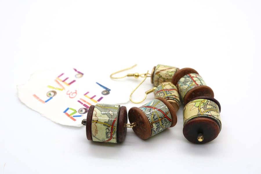 Long earrings of graded size paper beads made of an old map of Greater London