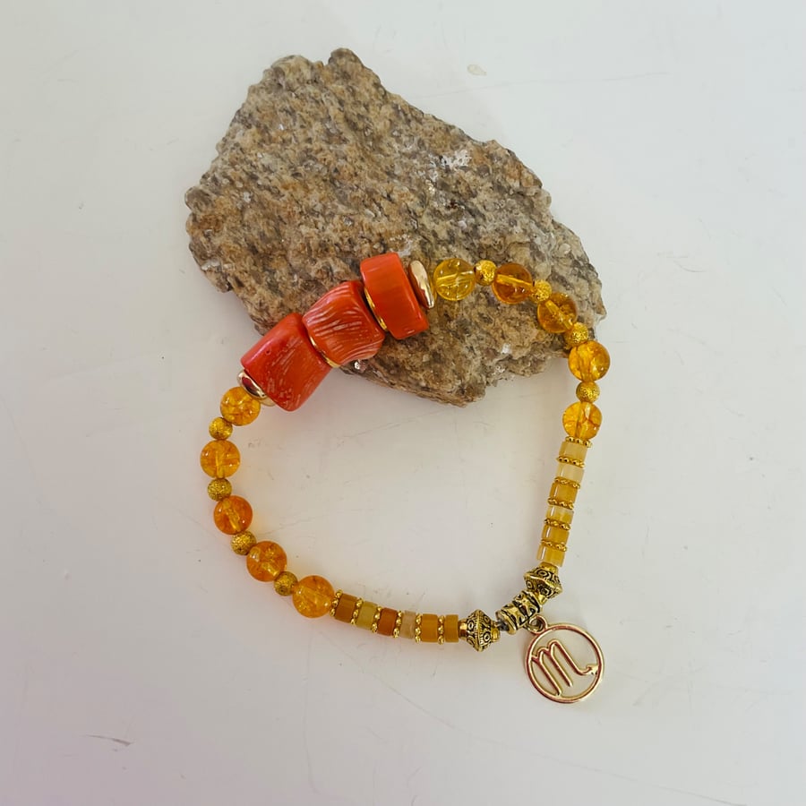 Image of November Scorpio birthday charm bracelet featuring semiprecious stones