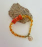 November Scorpio birthday charm bracelet featuring semiprecious stones