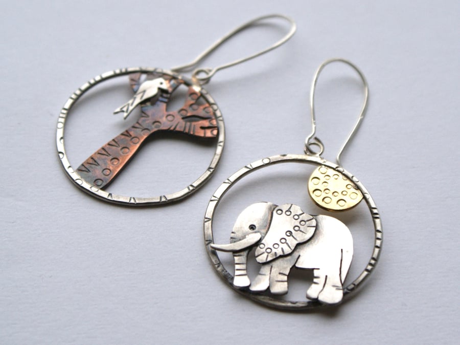 Sun worship statement earrings - elephant and bird