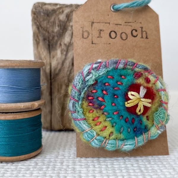 Needle felted hand embroidered circular brooch 