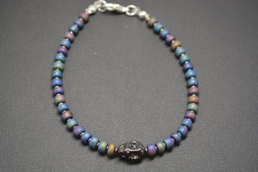 Black metallic seed bead bracelet with black skull