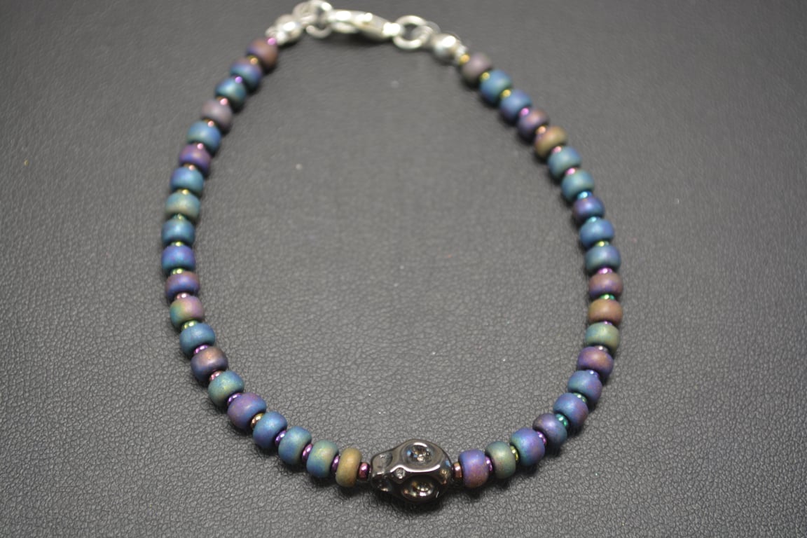 Black metallic seed bead bracelet with black skull