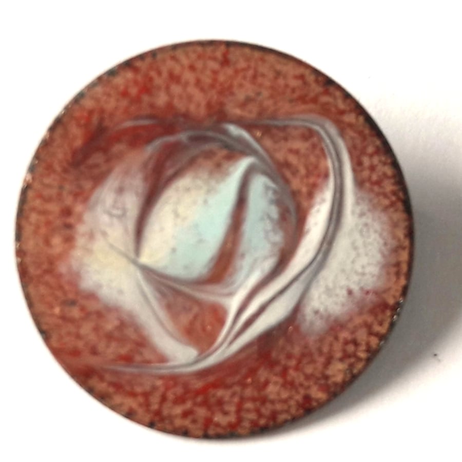 enamel brooch - round: scrolled white, brick red over clear