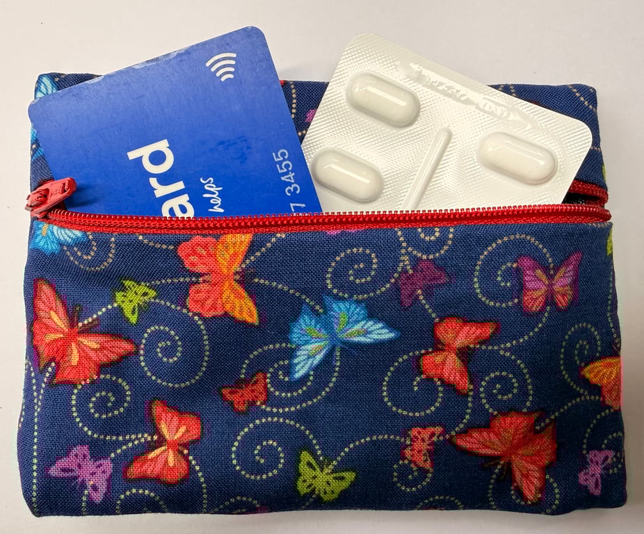 Small zipped purse - multicoloured butterflies on navy with scarlet zip