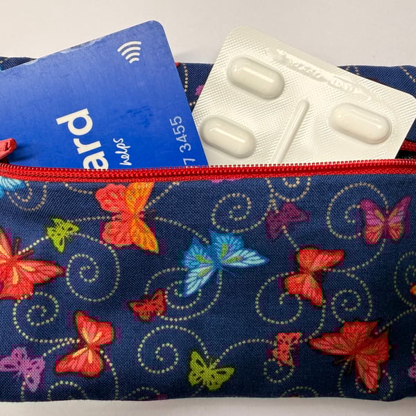 Small zipped purse - multicoloured butterflies on navy with scarlet zip