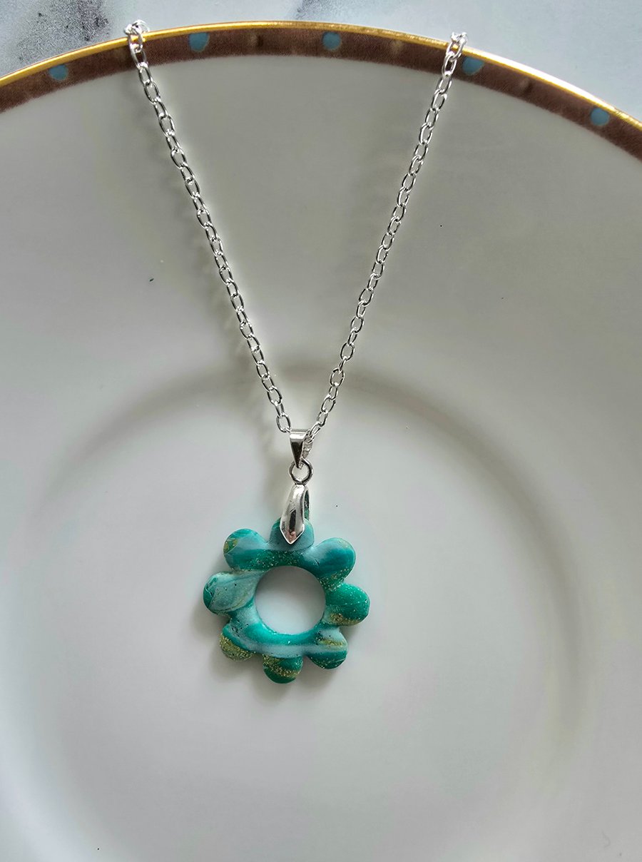 Polymer green and gold flower necklace on a silver plated chain