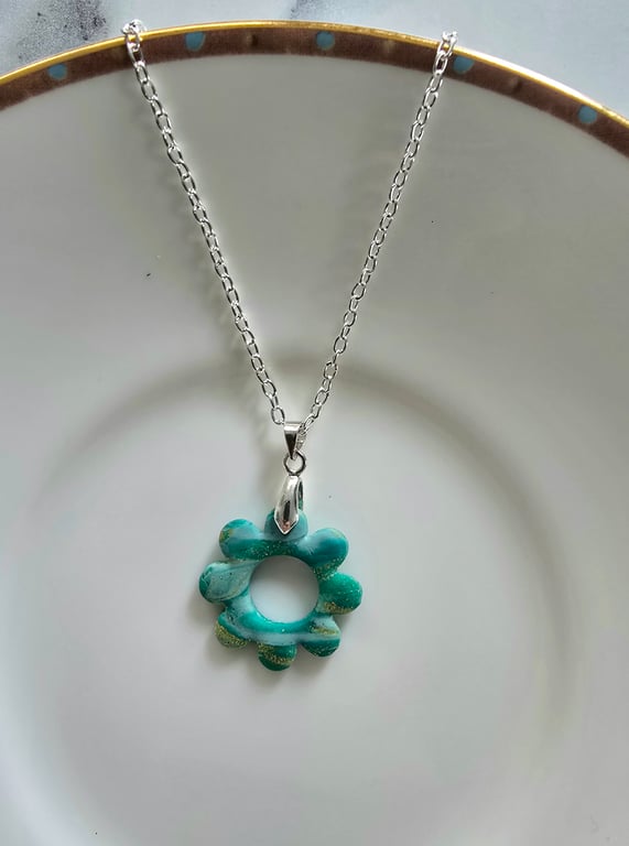 Polymer green and gold flower necklace on a silver plated chain