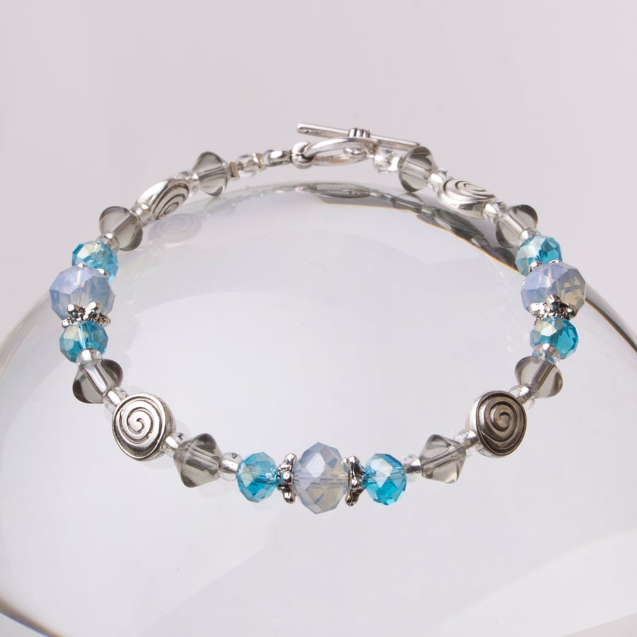Opalite and blue bead bracelet with spirals