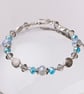 Opalite and blue bead bracelet with spirals - Image 1