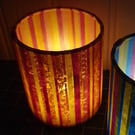 Stripy design collaged-paper lantern with LED candle (yellows and pinks)