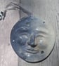 Man in the Moon with astronaut, hanging plaque