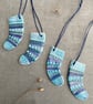 Set of four ceramic sock decorations .