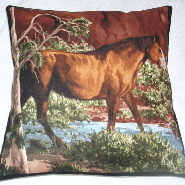 A beautiful chestnut brown and white horse stepping through a stream cushion