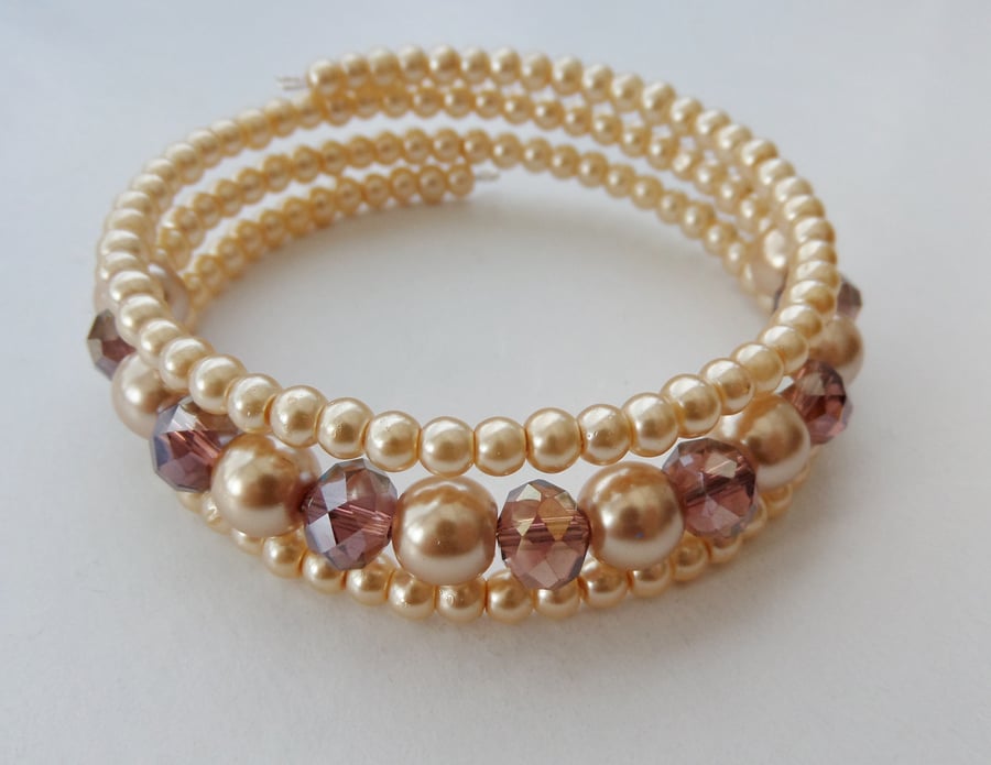 Light purple AB crystal rondelle and pale gold glass pearl memory wire bracelet.