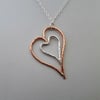 Nested Hearts Pendant in Sterling Silver and Copper 