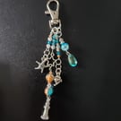 Nautical silver beaded bag charm with lighthouse, dolphin and dolphin charms