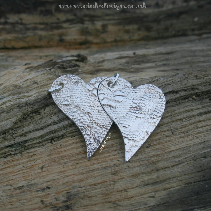 Two fine silver heart pendants