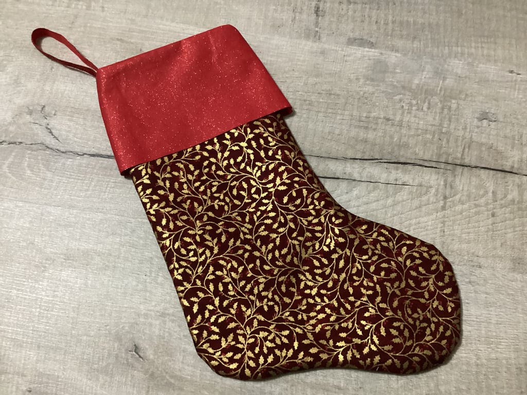 Christmas stocking in red and gold, floral.