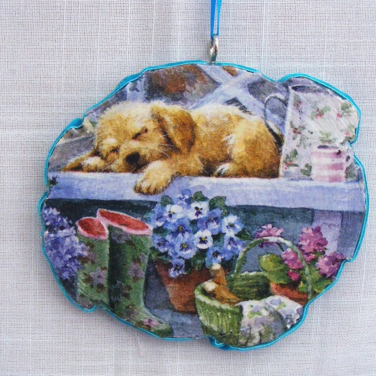 Sleeping dog decoupaged log slice wall hanging